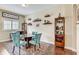 Small dining area with round table and four teal chairs at 1045 Tracey Ann Loop, Seffner, FL 33584