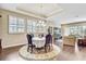 Elegant dining room featuring a round table and chandelier at 1045 Tracey Ann Loop, Seffner, FL 33584