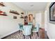 Dining room with round table, four chairs, and decorative shelving at 1045 Tracey Ann Loop, Seffner, FL 33584