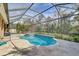 Inviting screened pool and spa with tiled deck at 1045 Tracey Ann Loop, Seffner, FL 33584