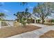 Tan house with brown garage door and landscaping; nice curb appeal at 11206 Silver Fern Way, Riverview, FL 33569