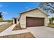 Tan house with brown garage door and walkway, nice curb appeal at 11206 Silver Fern Way, Riverview, FL 33569