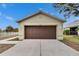 Tan house with brown garage door, front yard, and walkway at 11206 Silver Fern Way, Riverview, FL 33569