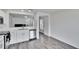 White kitchen cabinets and stainless steel appliances at 11206 Silver Fern Way, Riverview, FL 33569