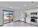 Kitchen with stainless steel appliances and pond view at 11206 Silver Fern Way, Riverview, FL 33569