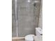 Bathroom showcases a glass-enclosed shower with tiled walls and built-in shelving at 12368 70Th St, Largo, FL 33773