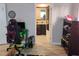 View of the bedroom with a gaming setup and a doorway leading into a bathroom at 12368 70Th St, Largo, FL 33773