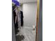 A well lit walk-in closet with wood laminate flooring at 12368 70Th St, Largo, FL 33773