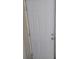 Image of the white, paneled interior door featuring new lockset and hinges at 12368 70Th St, Largo, FL 33773