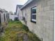 Extended view of the home's exterior, depicting its layout and outdoor equipment placement at 12368 70Th St, Largo, FL 33773