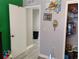 Hallway entrance, next to closet and green wall, features wood-look flooring at 12368 70Th St, Largo, FL 33773