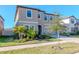 Charming two-story house with a manicured lawn and tasteful landscaping enhancing its curb appeal under a clear blue sky at 12625 Horseshoe Bend Dr, Lithia, FL 33547