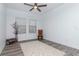 Inviting living space showcasing gray wood floors, neutral walls, and natural light streaming through the well-placed windows at 12625 Horseshoe Bend Dr, Lithia, FL 33547