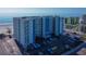 Aerial view of the Sea Breeze condo building and beach access in a desirable waterfront community at 13500 Gulf Blvd # 702, Madeira Beach, FL 33708