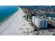 A beautiful coastal view of condos, a pristine white-sand beach, and the ocean at 13500 Gulf Blvd # 702, Madeira Beach, FL 33708