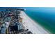 Luxury condos on the beach with a coastal town on one side and blue ocean waters on the other at 13500 Gulf Blvd # 702, Madeira Beach, FL 33708