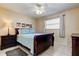 Bedroom with a ceiling fan, neutral walls, and a queen-sized bed at 13500 Gulf Blvd # 702, Madeira Beach, FL 33708