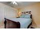 Bedroom with a ceiling fan, neutral walls, and a queen-sized bed at 13500 Gulf Blvd # 702, Madeira Beach, FL 33708