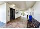 Hallway featuring an elevator with a tiled floor and seating for guests at 13500 Gulf Blvd # 702, Madeira Beach, FL 33708