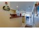 Cozy kitchen with cream-colored cabinets that opens to the living room and ocean view at 13500 Gulf Blvd # 702, Madeira Beach, FL 33708