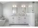 Elegant bathroom with dual sinks, marble countertops, soaking tub and glass enclosed shower at 1442 Harbour Walk Rd, Tampa, FL 33602