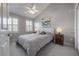 Cozy bedroom features neutral decor, shuttered windows, plush carpet, and natural light at 1442 Harbour Walk Rd, Tampa, FL 33602