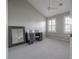 Spacious bedroom with gray carpet, a ceiling fan, large mirror, and a desk area at 1442 Harbour Walk Rd, Tampa, FL 33602