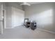 Bedroom featuring gray carpet, a ceiling fan, a desk area, and double door closet at 1442 Harbour Walk Rd, Tampa, FL 33602