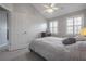 Neutral colored bedroom featuring a ceiling fan, shuttered windows, and a comfortable bed at 1442 Harbour Walk Rd, Tampa, FL 33602