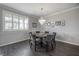 Charming dining room with gray walls, a chandelier, and a window with shutters at 1442 Harbour Walk Rd, Tampa, FL 33602