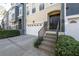 A covered entryway leads to an attached garage in this well maintained townhome at 1442 Harbour Walk Rd, Tampa, FL 33602