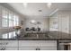 Stylish kitchen with stainless steel sink and granite countertops, open to the dining area at 1442 Harbour Walk Rd, Tampa, FL 33602