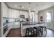 Bright kitchen featuring stainless steel appliances, granite countertops, and dark hardwood flooring at 1442 Harbour Walk Rd, Tampa, FL 33602