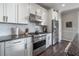 A well-equipped kitchen featuring a stainless steel stove, vent hood, and appliances at 1442 Harbour Walk Rd, Tampa, FL 33602