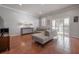 Bright living room with tile flooring, a comfortable sectional sofa, and sliding glass doors at 1442 Harbour Walk Rd, Tampa, FL 33602