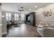 Spacious living room featuring a large entertainment center, recessed lights, and hardwood floors at 1442 Harbour Walk Rd, Tampa, FL 33602