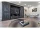 Living room with a large entertainment center, hardwood floors and recessed lighting at 1442 Harbour Walk Rd, Tampa, FL 33602