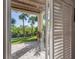 Charming covered patio with brick pavers and a view of lush tropical landscaping at 1442 Harbour Walk Rd, Tampa, FL 33602