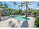 Inviting pool with lounge chairs, surrounded by lush greenery at 1442 Harbour Walk Rd, Tampa, FL 33602