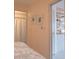 Hallway that opens to a bathroom and a kitchen, showing the easy flow and accessibility of the home at 145 10Th N Ave # 8, St Petersburg, FL 33701