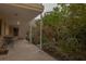 Relaxing patio space with table and chairs, enhanced by a lush garden view at 145 10Th N Ave # 8, St Petersburg, FL 33701