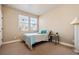 Bedroom featuring neutral carpet, light-colored walls, and large windows at 14543 Mirabelle Vista Cir, Tampa, FL 33626