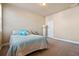 Bedroom featuring an accent wall, neutral carpet, and light-colored walls at 14543 Mirabelle Vista Cir, Tampa, FL 33626