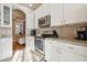 Modern kitchen featuring white cabinetry, stainless steel appliances, and granite countertops at 14543 Mirabelle Vista Cir, Tampa, FL 33626