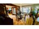 Inviting dining area featuring a glass table, seating for six, and a decorative chandelier at 1670 Monterey Dr, Clearwater, FL 33756