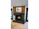 Cozy fireplace with stone surround, wooden mantle, and decorative candle lighting at 1670 Monterey Dr, Clearwater, FL 33756