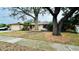 Single Gathering home with mature trees and large front yard at 1670 Monterey Dr, Clearwater, FL 33756