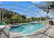 Screened pool with a spa and ample patio space for outdoor enjoyment at 20327 Merry Oak Ave, Tampa, FL 33647