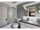 Bathroom with black and white striped wallpaper and a shower/tub combo at 2054 Envoy Ct, Clearwater, FL 33764