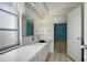 Simple bathroom with white vanity, large mirror, and window at 2054 Envoy Ct, Clearwater, FL 33764